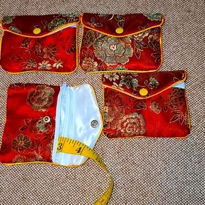 Four jewelry pouches